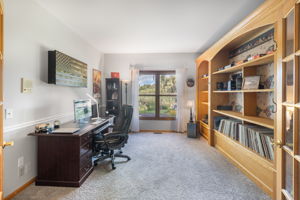 Den with French doors and built-in bookcase