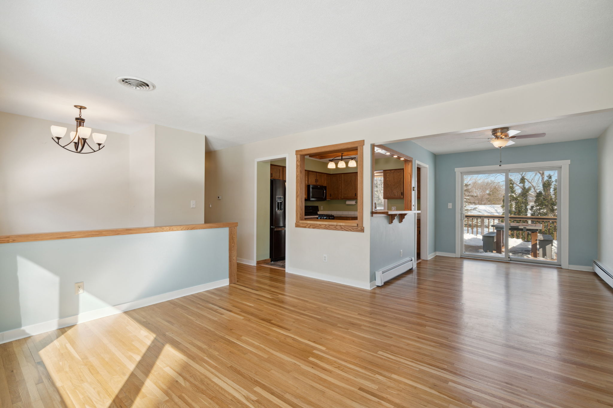 Spacious living room with large windows and gas fireplace
