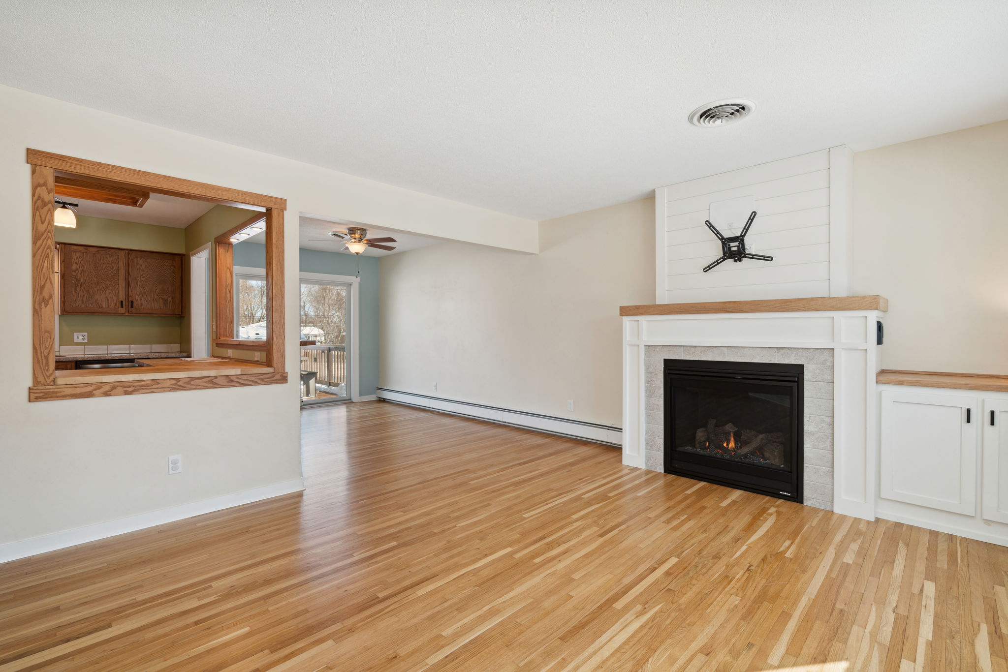 Spacious living room with large windows and gas fireplace