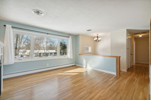 Spacious living room with large windows and gas fireplace