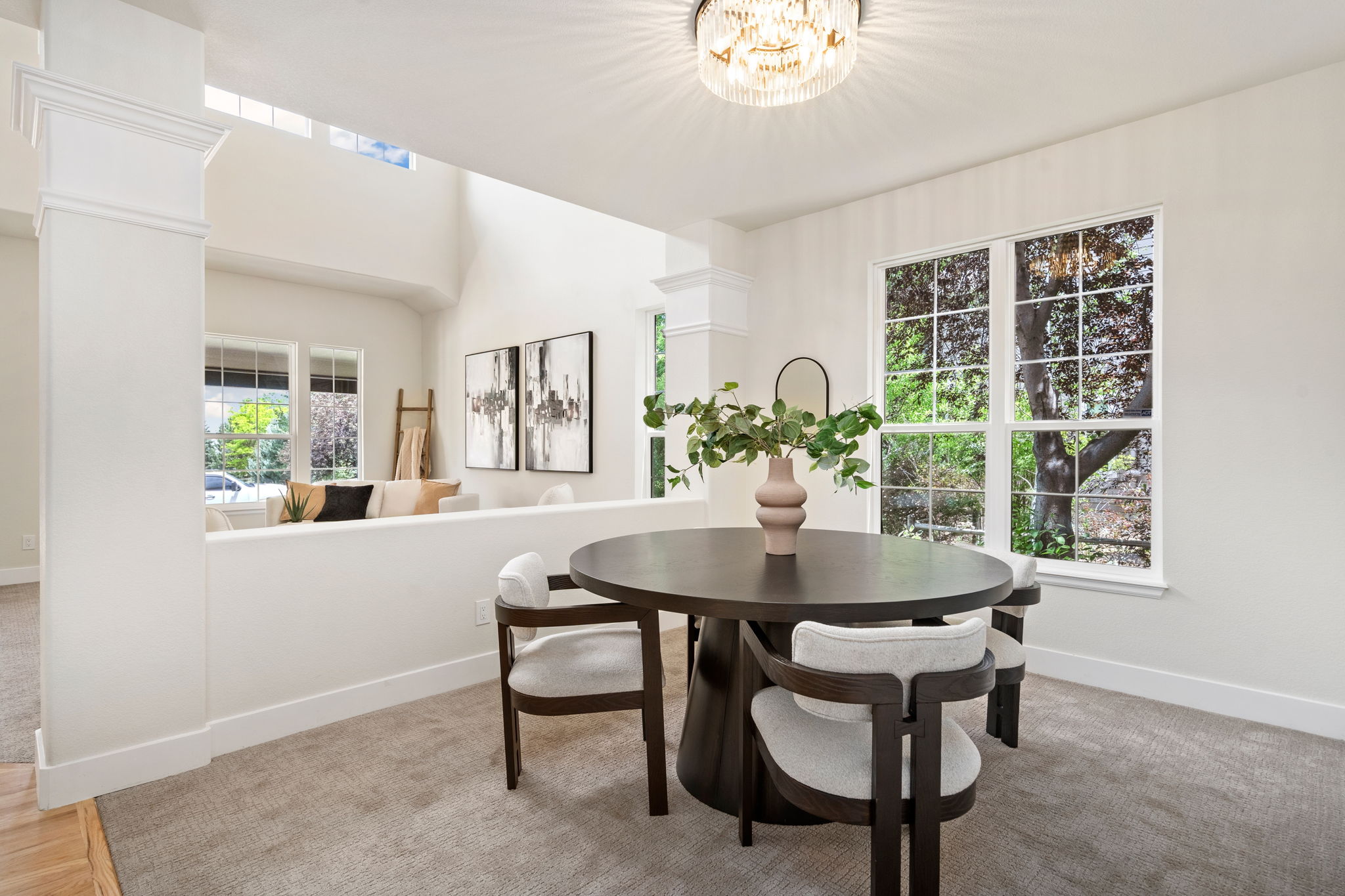 The separate dining area overlooking the outdoor space is a great place to enjoy dinner with friends.