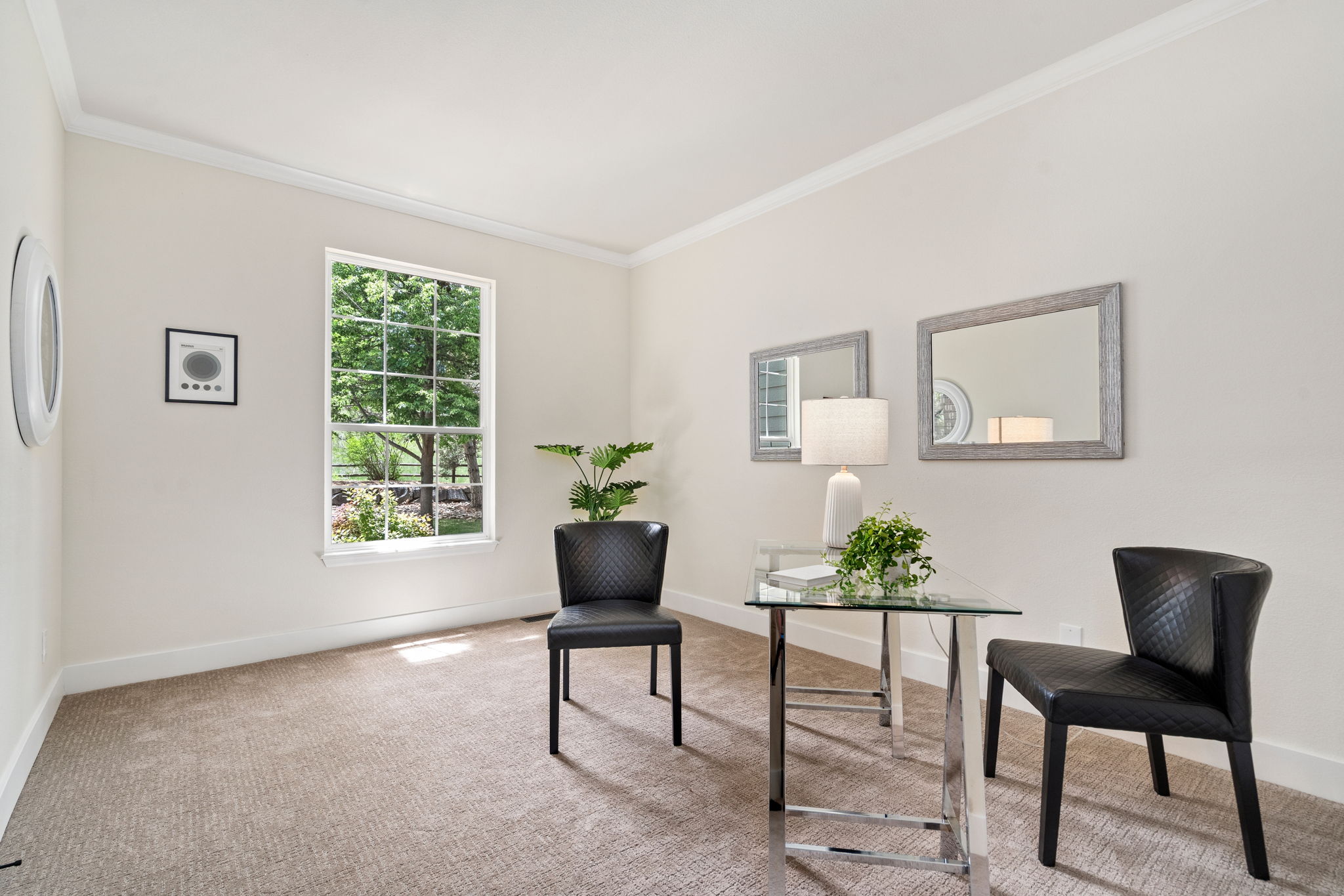 This main floor office or studio with french doors offers some privacy and a view to the backyard greenspace brings the outside in.