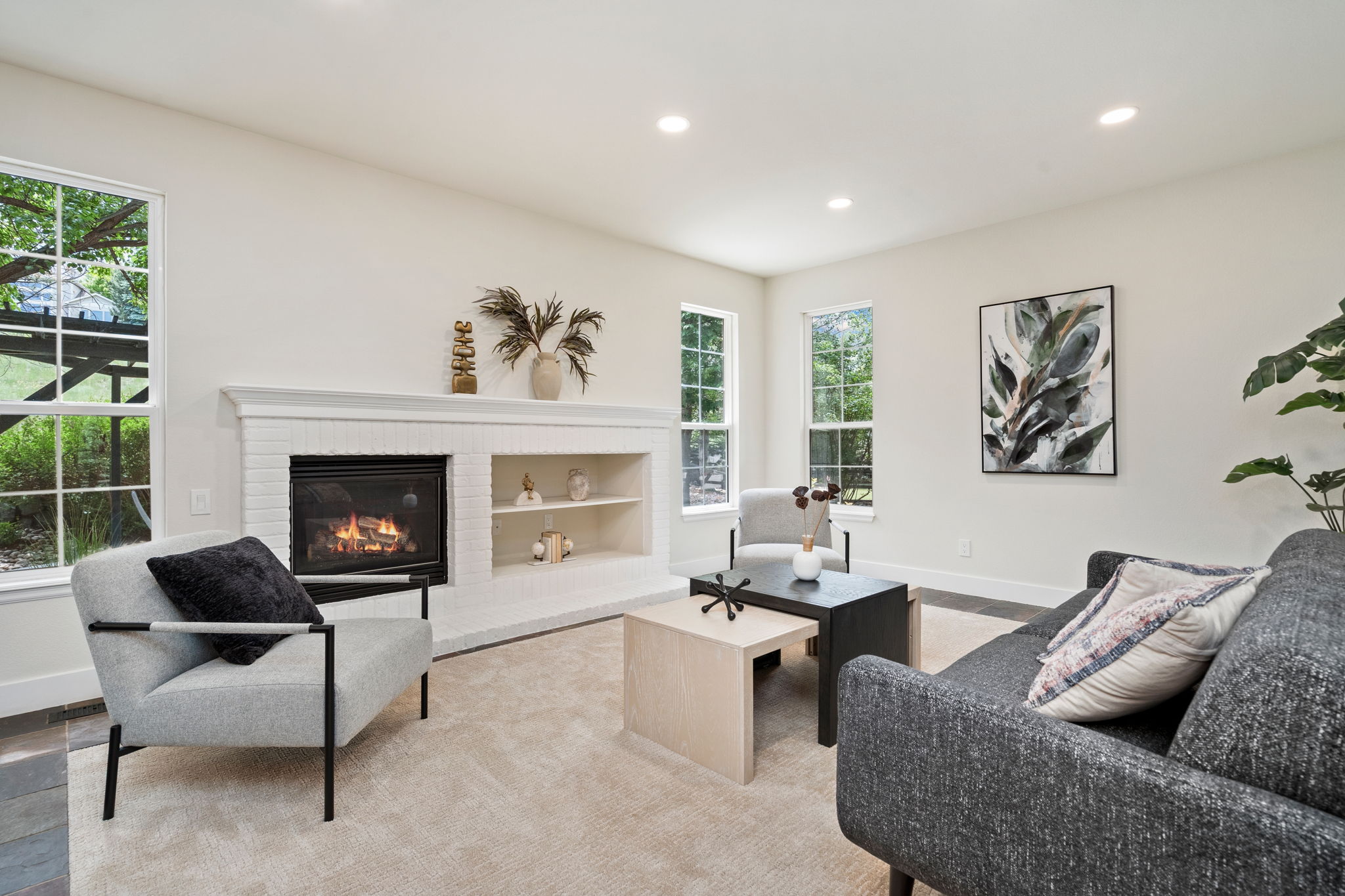 The family room, with its gas fireplace and views of the backyard greenbelt is a great place to hang out.