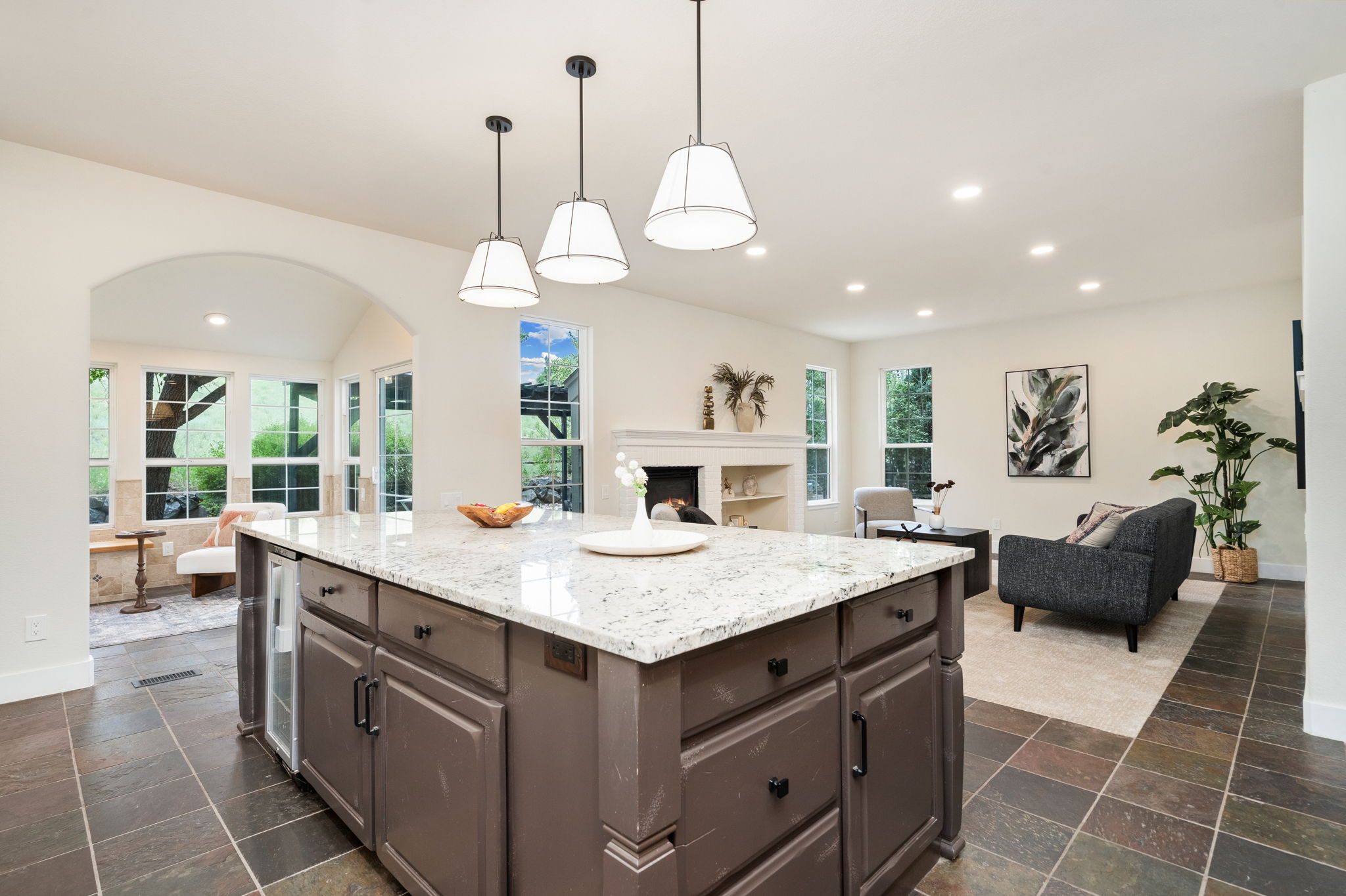This kitchen offers prime real estate within the home-its smart location and layout are sure to make it a favorite gathering spot.