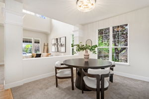 The separate dining area overlooking the outdoor space is a great place to enjoy dinner with friends.