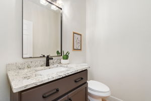 The main floor half-bath is conveniently located near the office/studio.