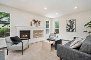 The family room, with its gas fireplace and views of the backyard greenbelt is a great place to hang out.