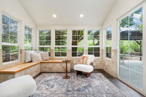 Rain, snow, or sunshine-this all-season sunroom off the kitchen with backyard access is the perfect spot to relax year-round!