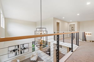 With open sightlines from upstairs to the entryway, the layout feels both grand and welcoming-connecting the home beautifully across both levels.