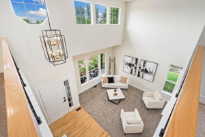 View from the second floor onto the entry and front living room. What a great layout that opens up the feeling of the whole house.