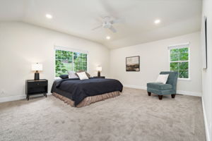 The primary bedroom overlooks the backyard, is complete with an ensuite bathroom and some separation from the other bedrooms for added privacy.