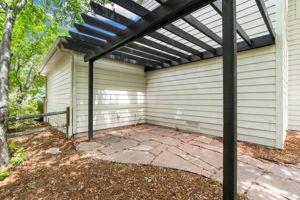 Could be a great space to add a hot tub or set up your grill master space. The views of the green space from this pergola are gorgeous!