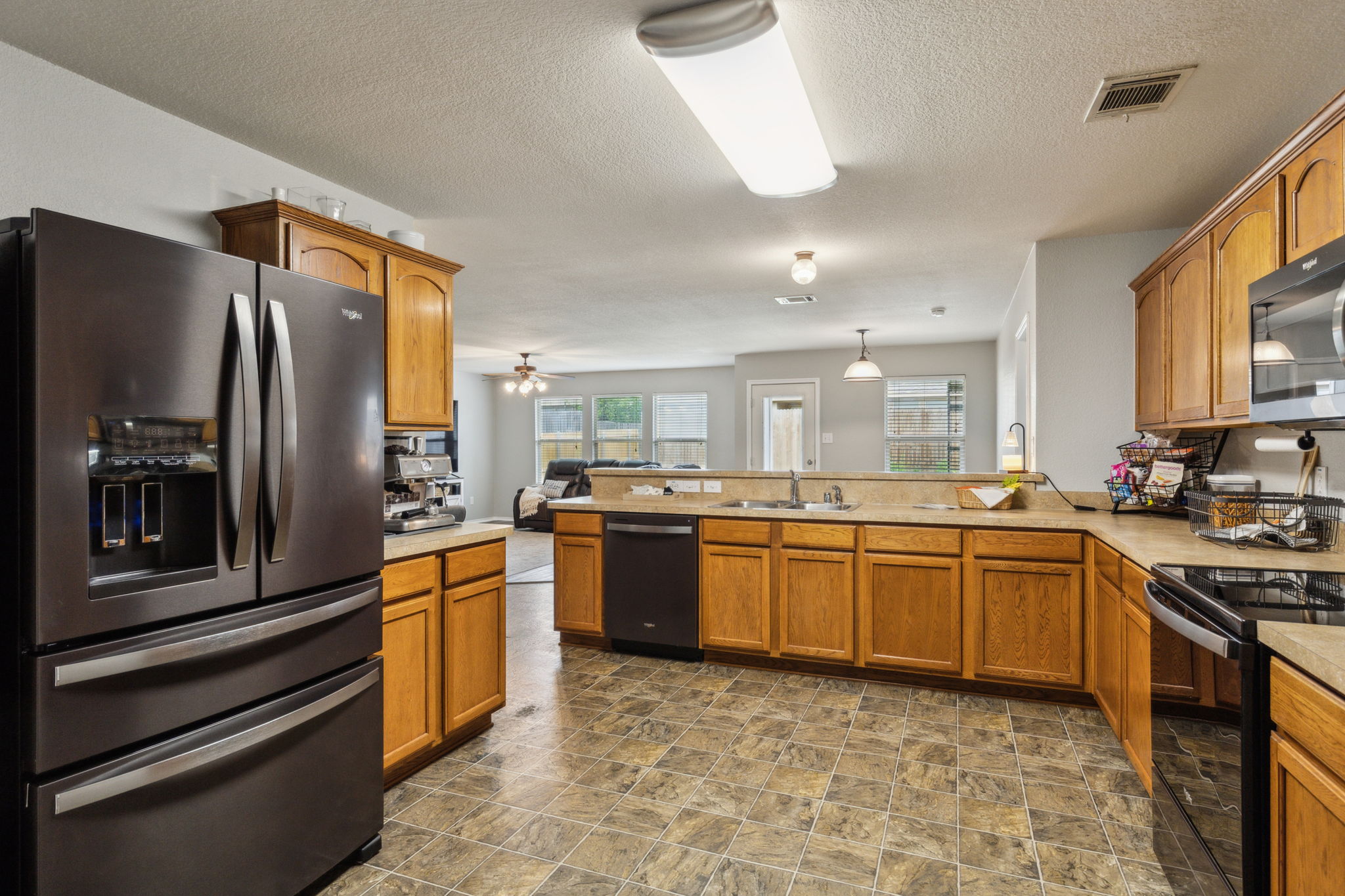 This kitchen design provides the perfect place for a coffee bar and breakfast bar seating!