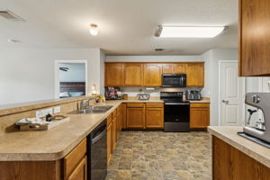 Check out all the counter space, cabinetry and the size of this roomy kitchen!