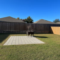 What a spacious backyard and patio!