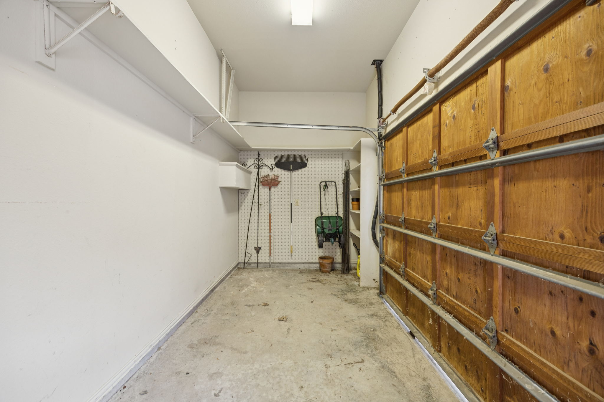 1/2 garage for lawn equipment