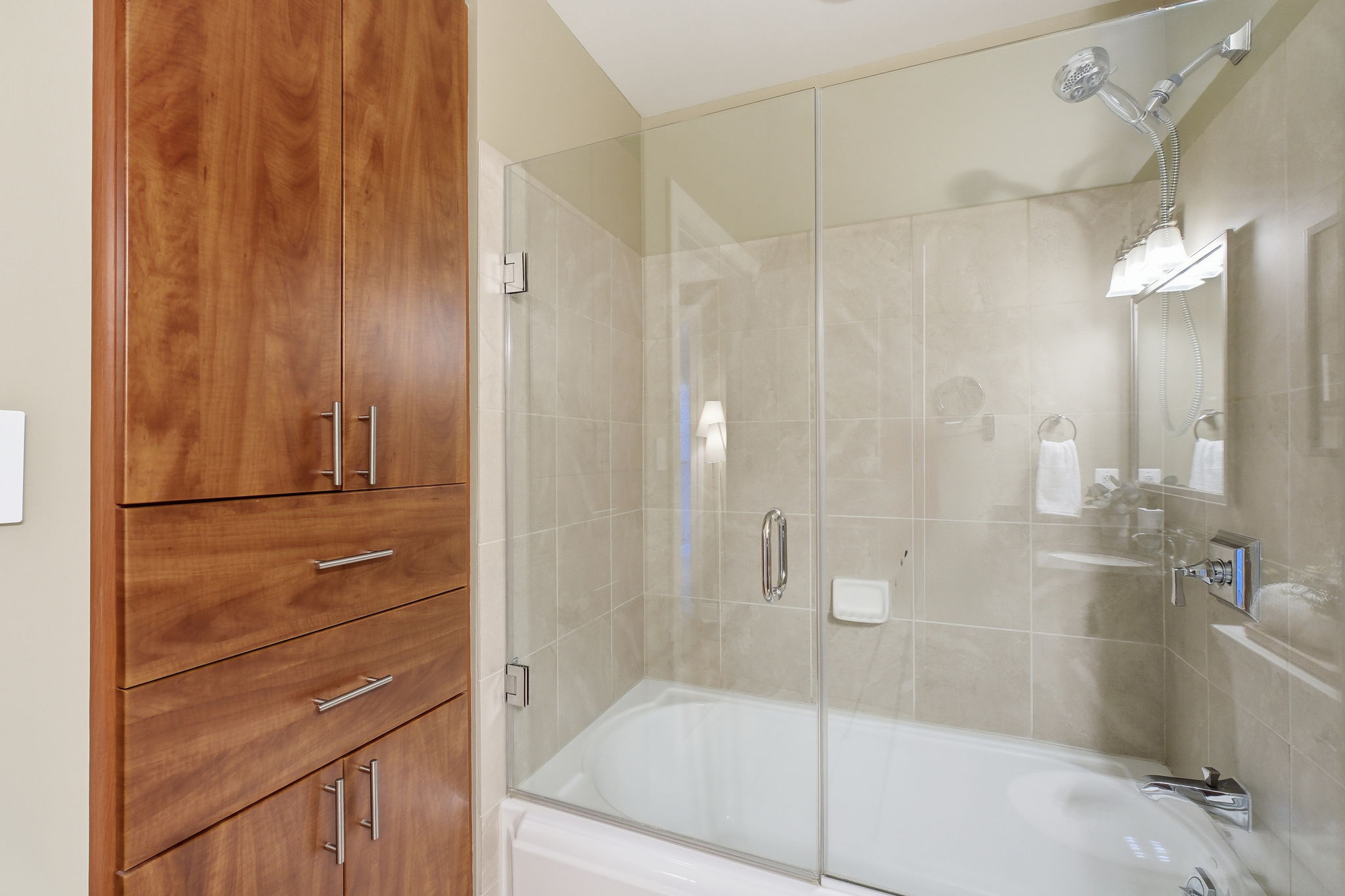 upgraded custom cabinetry & Kohler tub shower