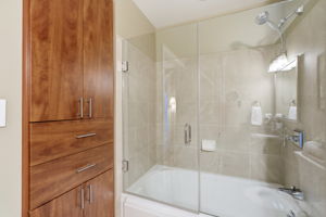 upgraded custom cabinetry & Kohler tub shower