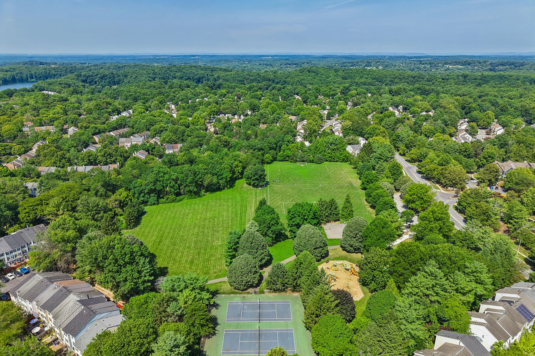 Sports courts and athletic fields throughout.