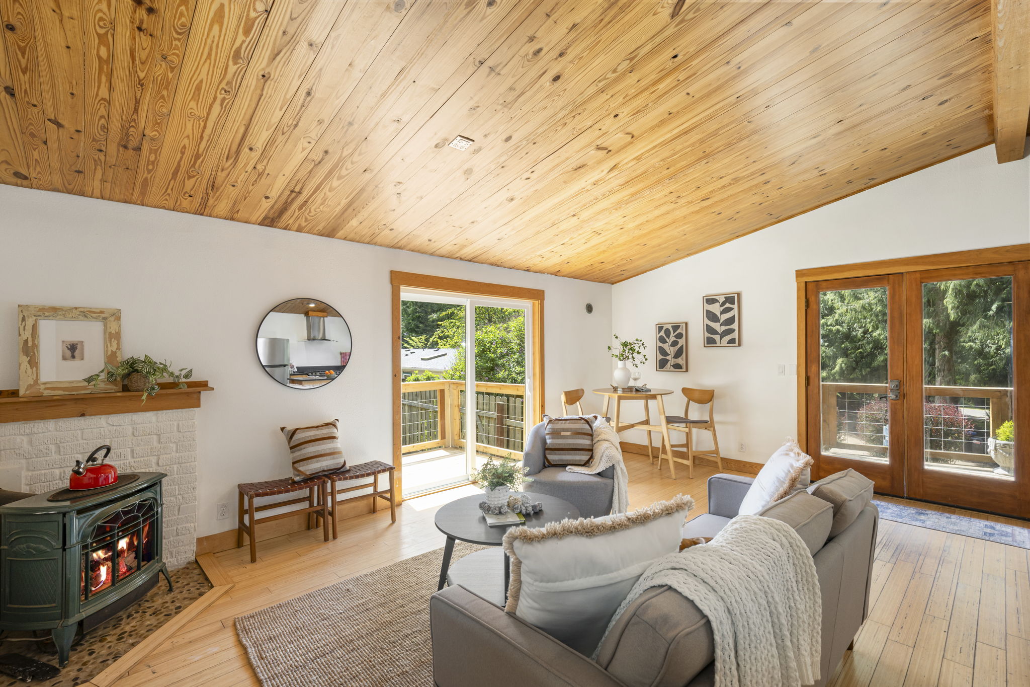 Double French doors lead to a large front deck and a slider leads to deck #2 of 3!