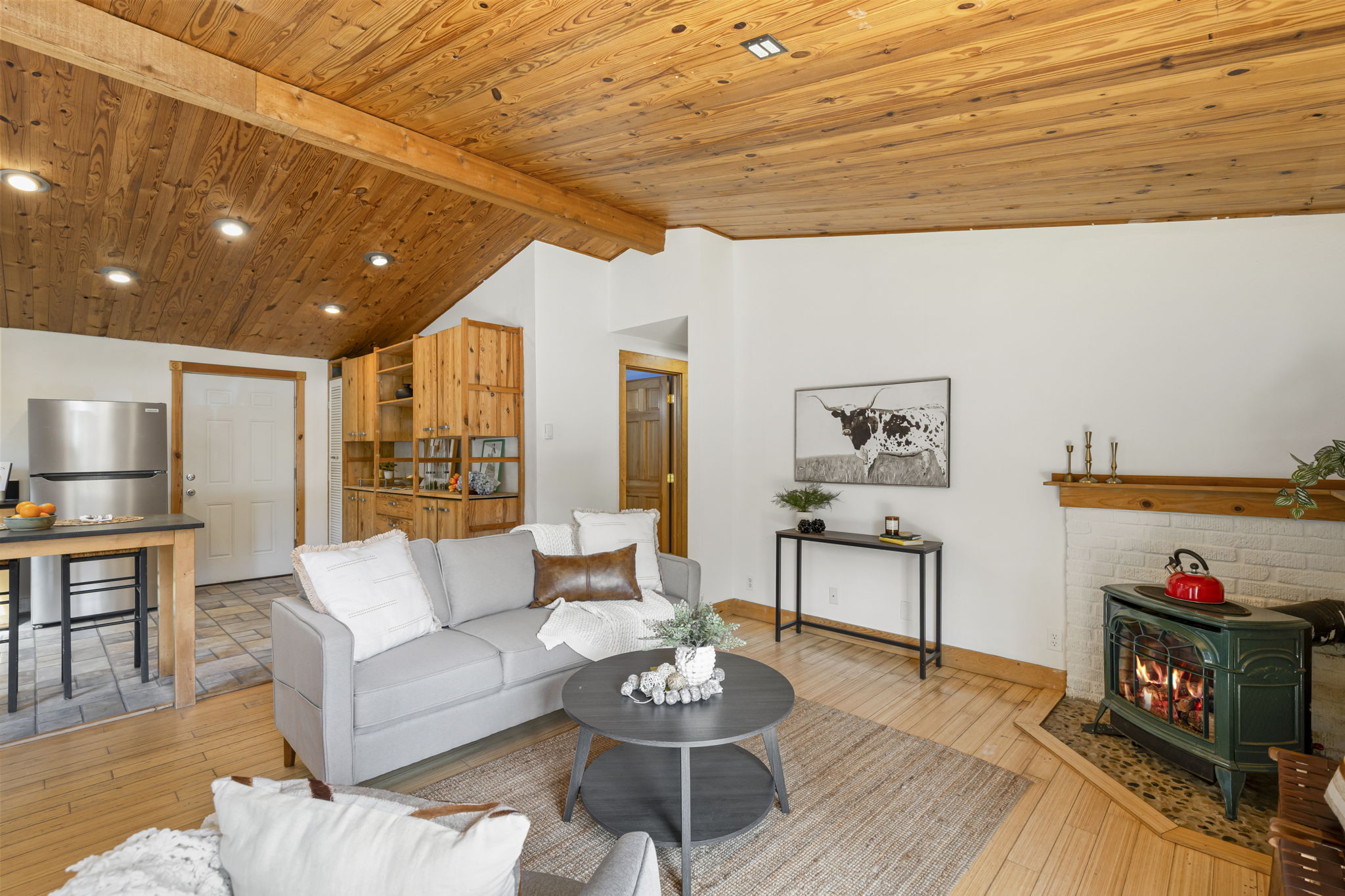 French doors lead you into a great room with vautled wood ceilings!
