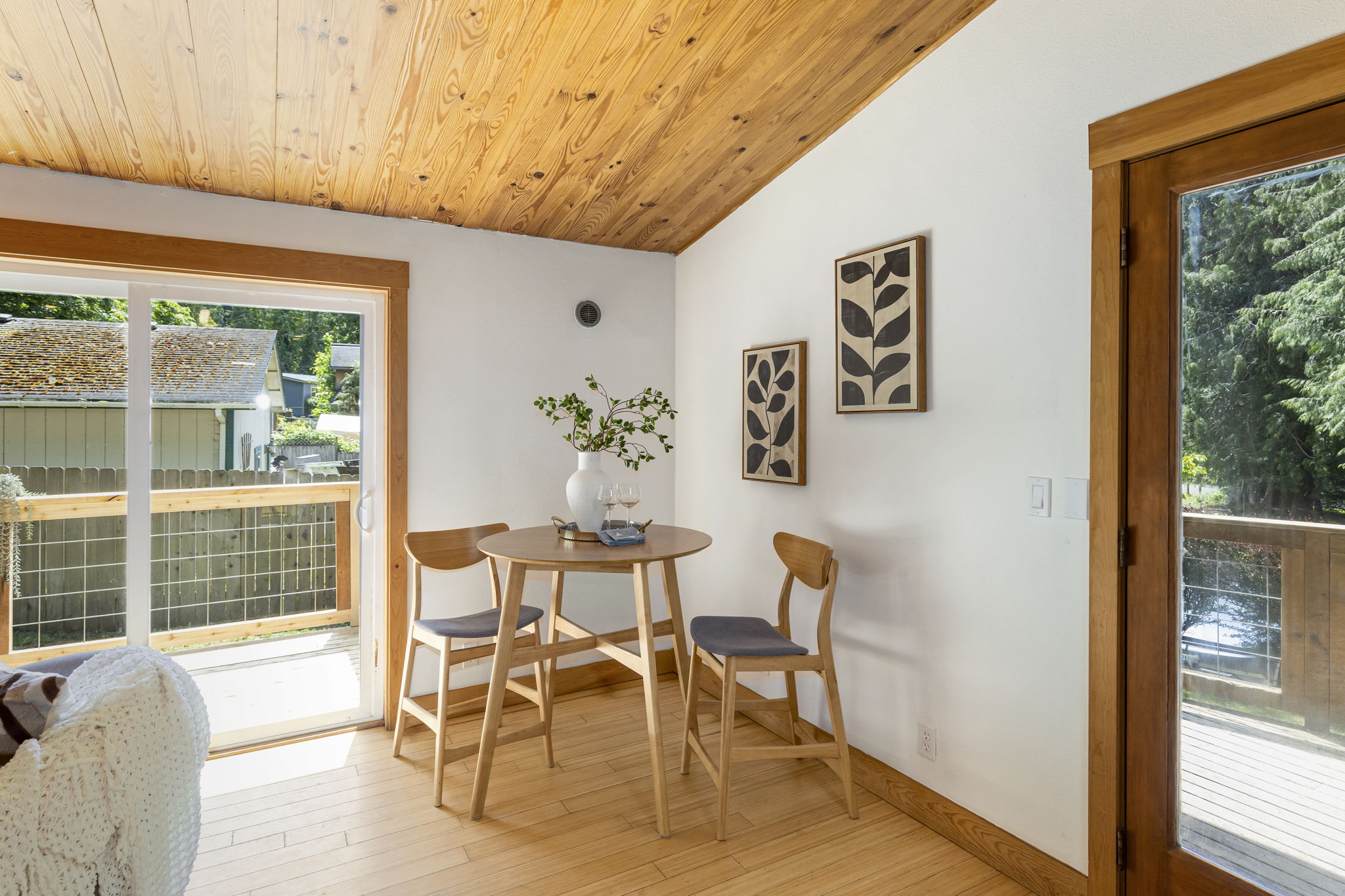 Double French doors lead to a large front deck and a slider leads to deck #2 of 3!