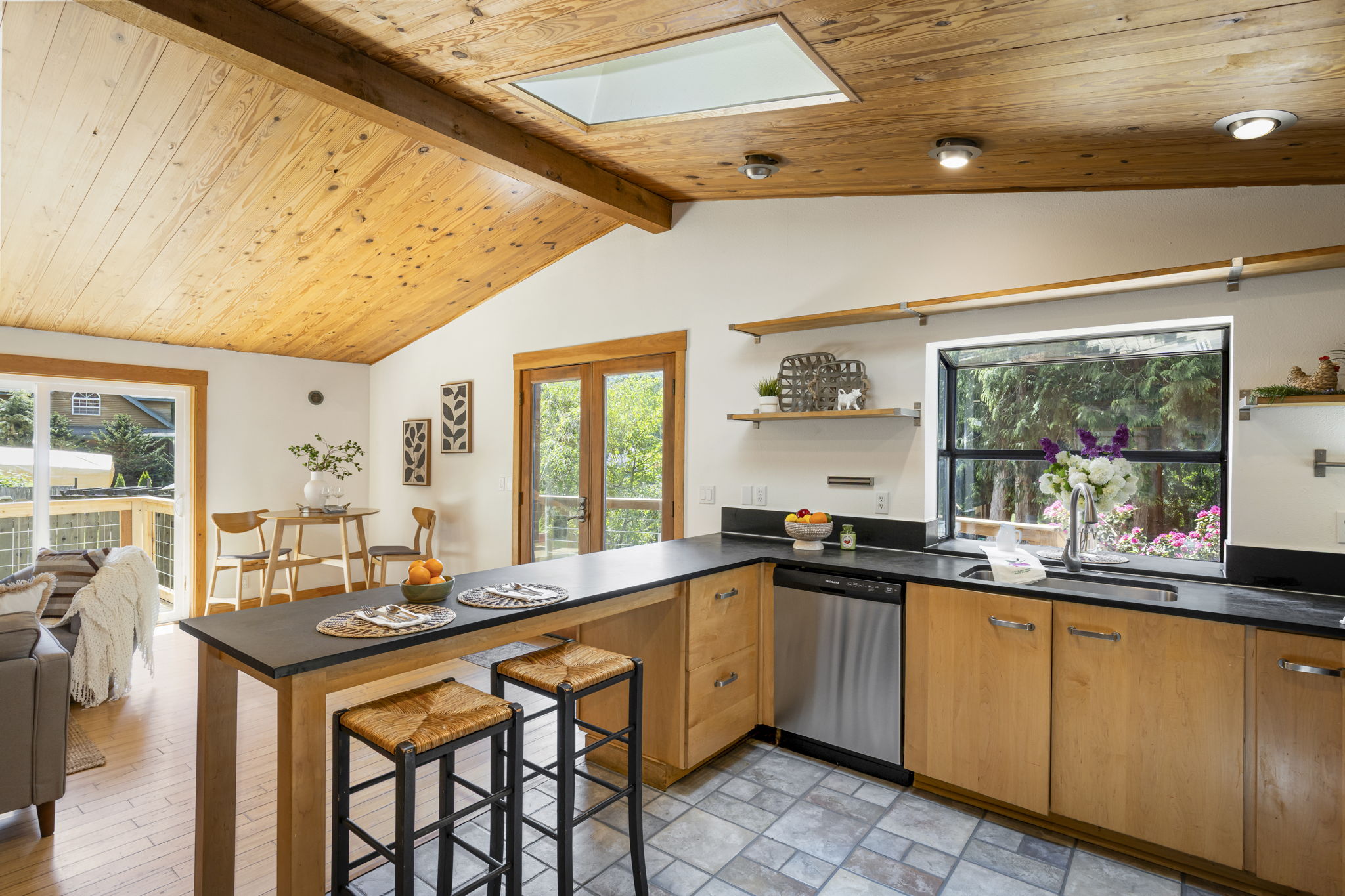Vaulted ceilings, skylight and garden window above kitchen sink...SO. MUCH. NATURAL LIGHT!