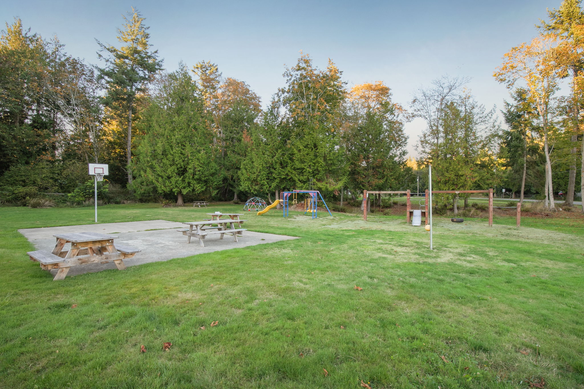 Park has been updated since this photo to include a newer swing set as well as freshly poured basketball/sport court!