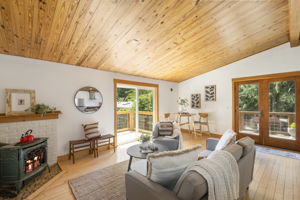 Double French doors lead to a large front deck and a slider leads to deck #2 of 3!