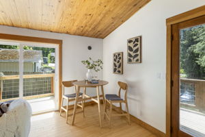 Double French doors lead to a large front deck and a slider leads to deck #2 of 3!