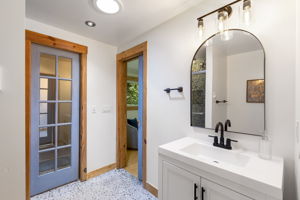Another view of the primary bath with blue door leading to closet!
