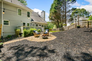 Backyard w/ Outdoor Lights and Firebowl