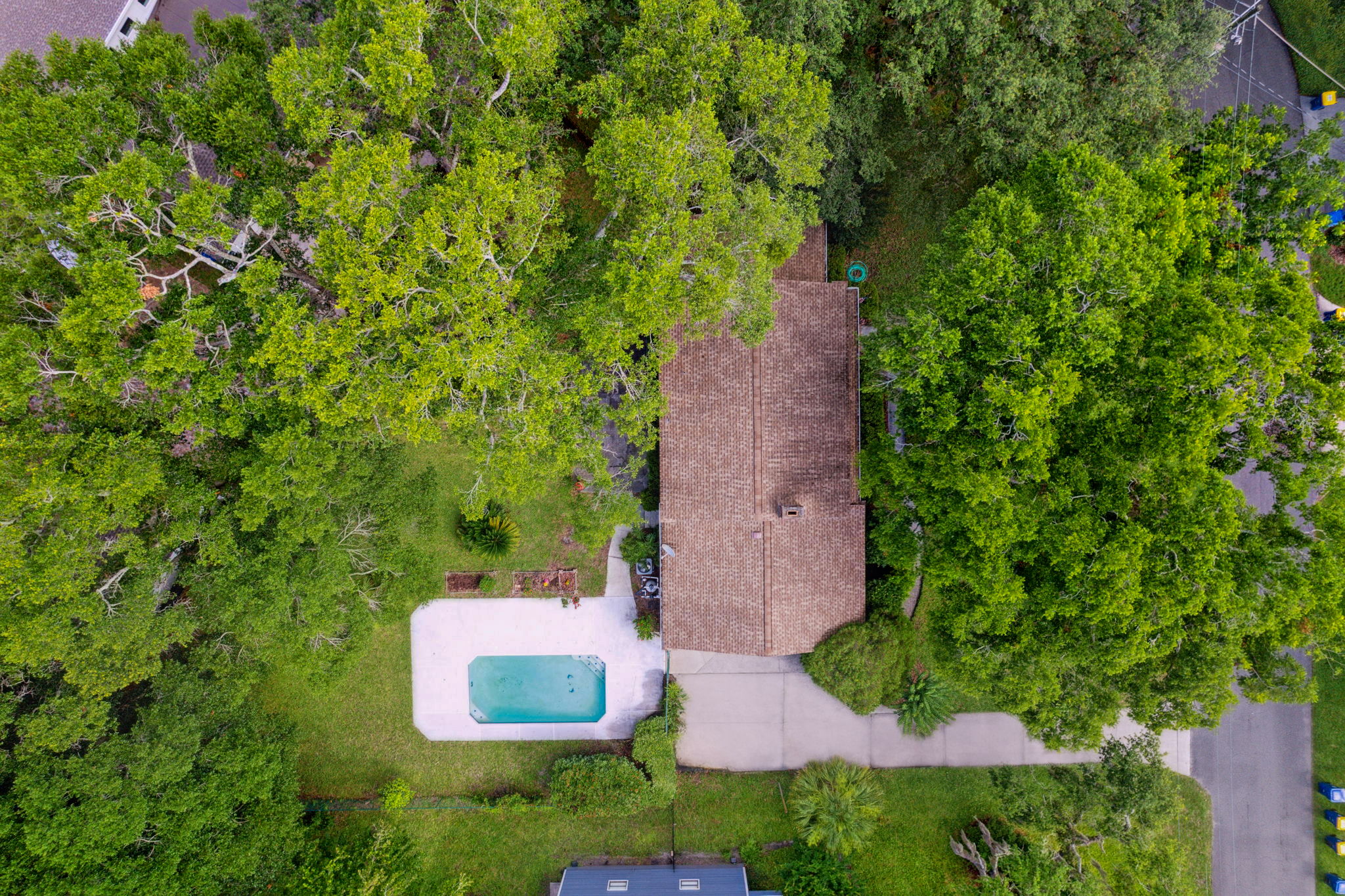 The yard is shaded by mature trees and comes with a fully fenced back yard.
