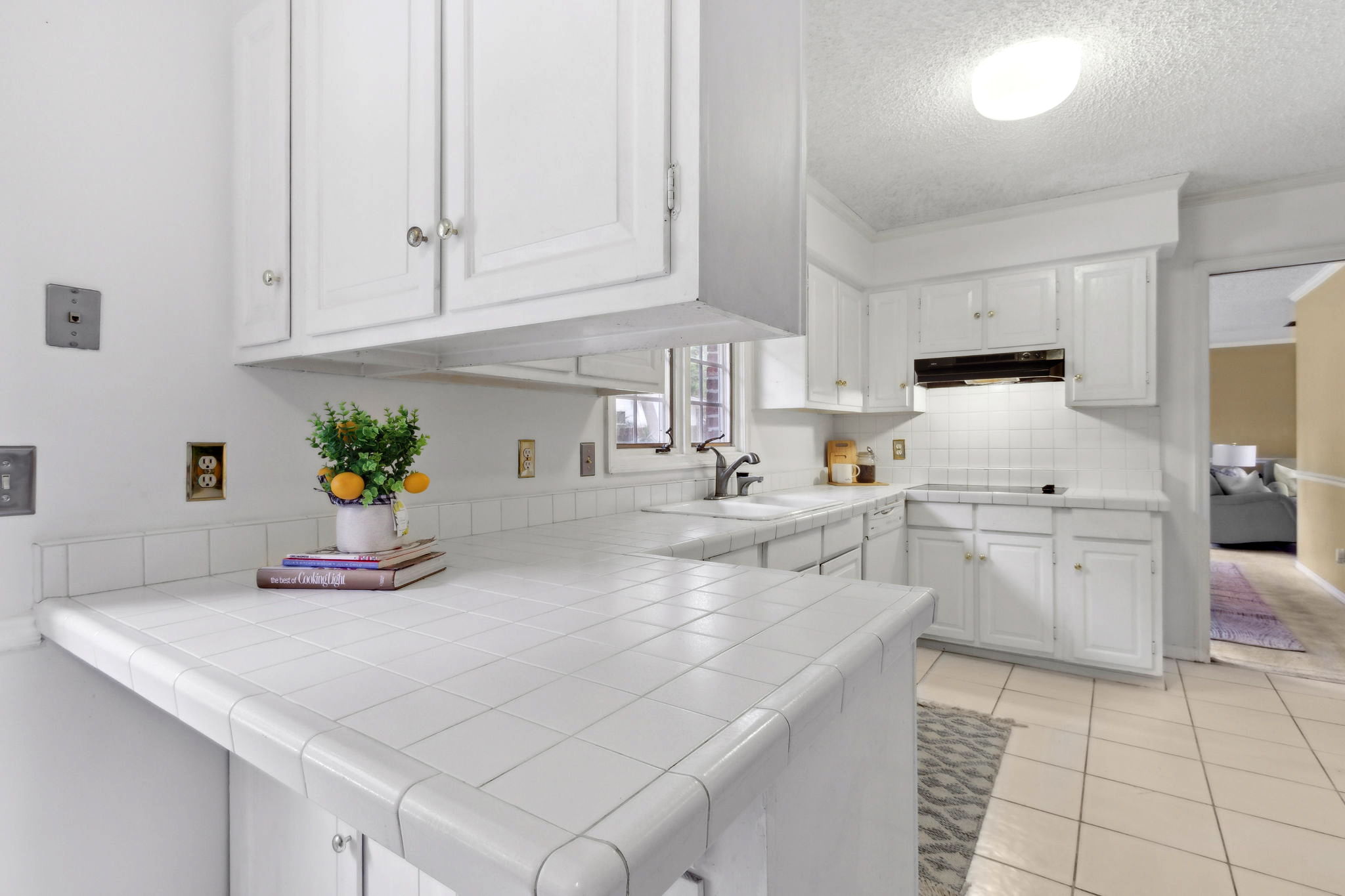 The kitchen is white and bright ...