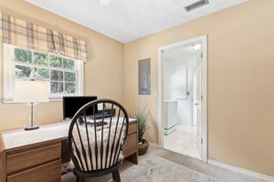 ...beyond is pictured a dual laundry room and full bath.