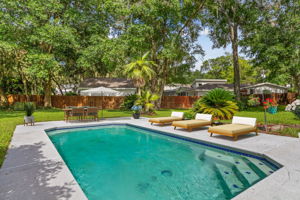 The large in-ground pool has appoximately a 10,000 gallon capacity (Virtually staged)