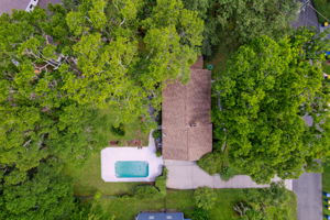 The yard is shaded by mature trees and comes with a fully fenced back yard.