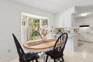 The cheery eat-in kitchen also features a bay window...