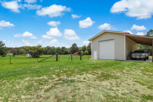 Workshop with side carport