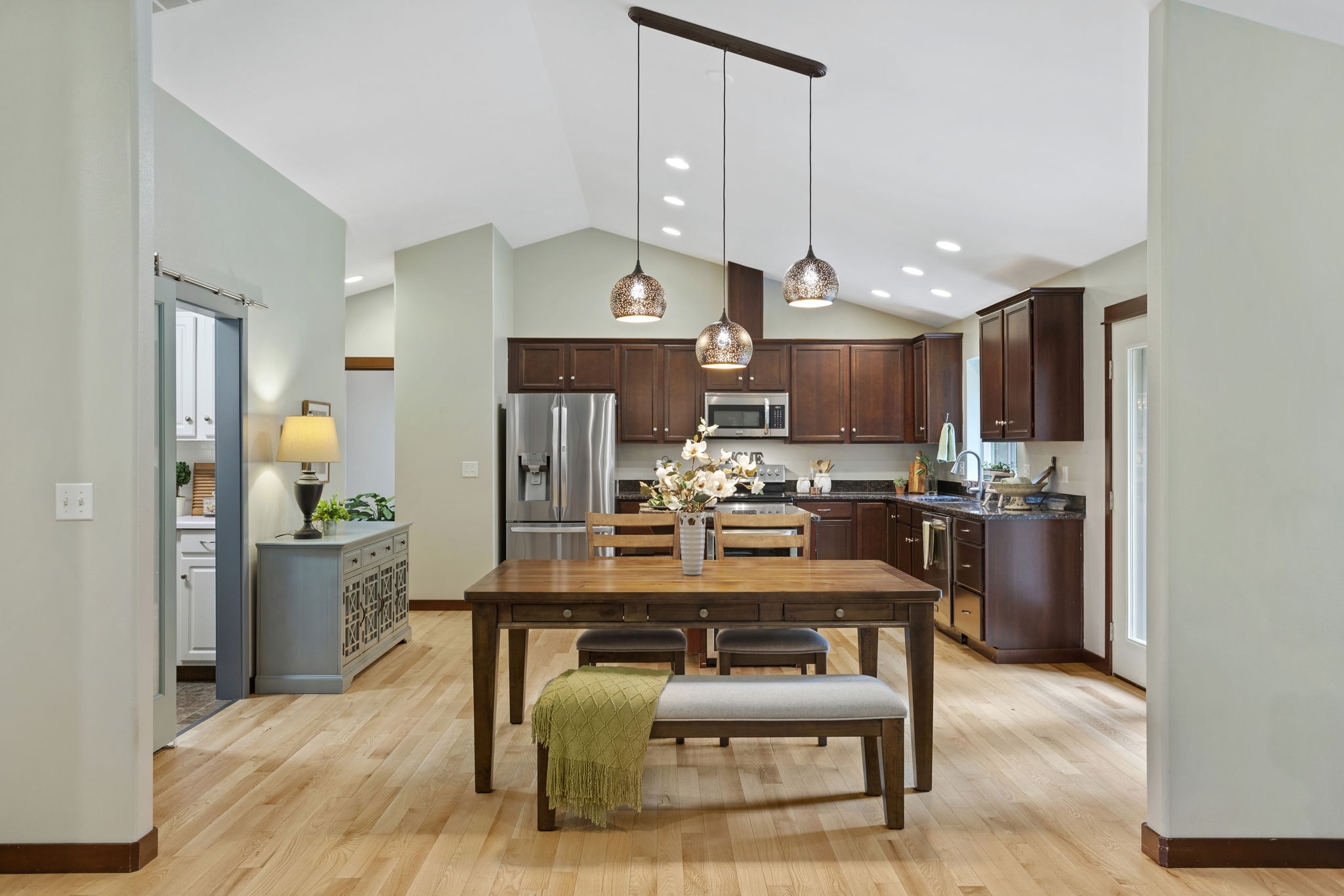 Great vaulted ceilings are carried into the kitchen and dining rooms light and bright rooms!