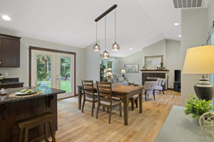 Beautiful custom light fixture in Dining room with ample space for large dining table