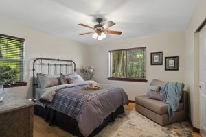 Large secondary bedroom with beautiful wooded views of the property from your 2 windows!
