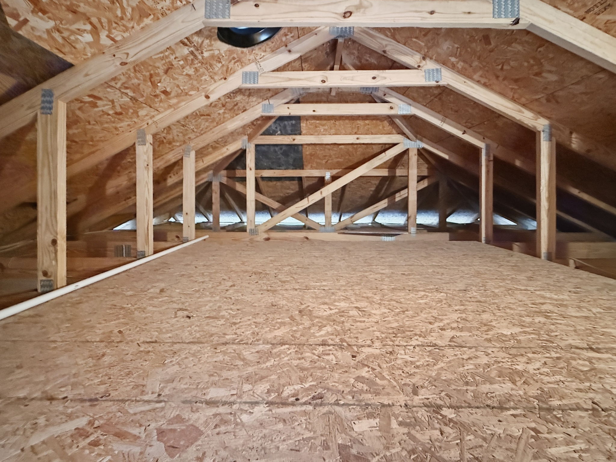 Expansive Attic Storage with Plywood Flooring