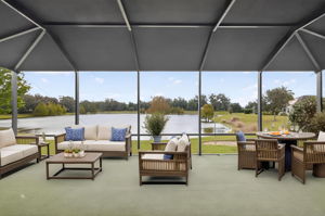 Virtually Staged - Spacious Rear Screened Porch with Canopy and Water Views!