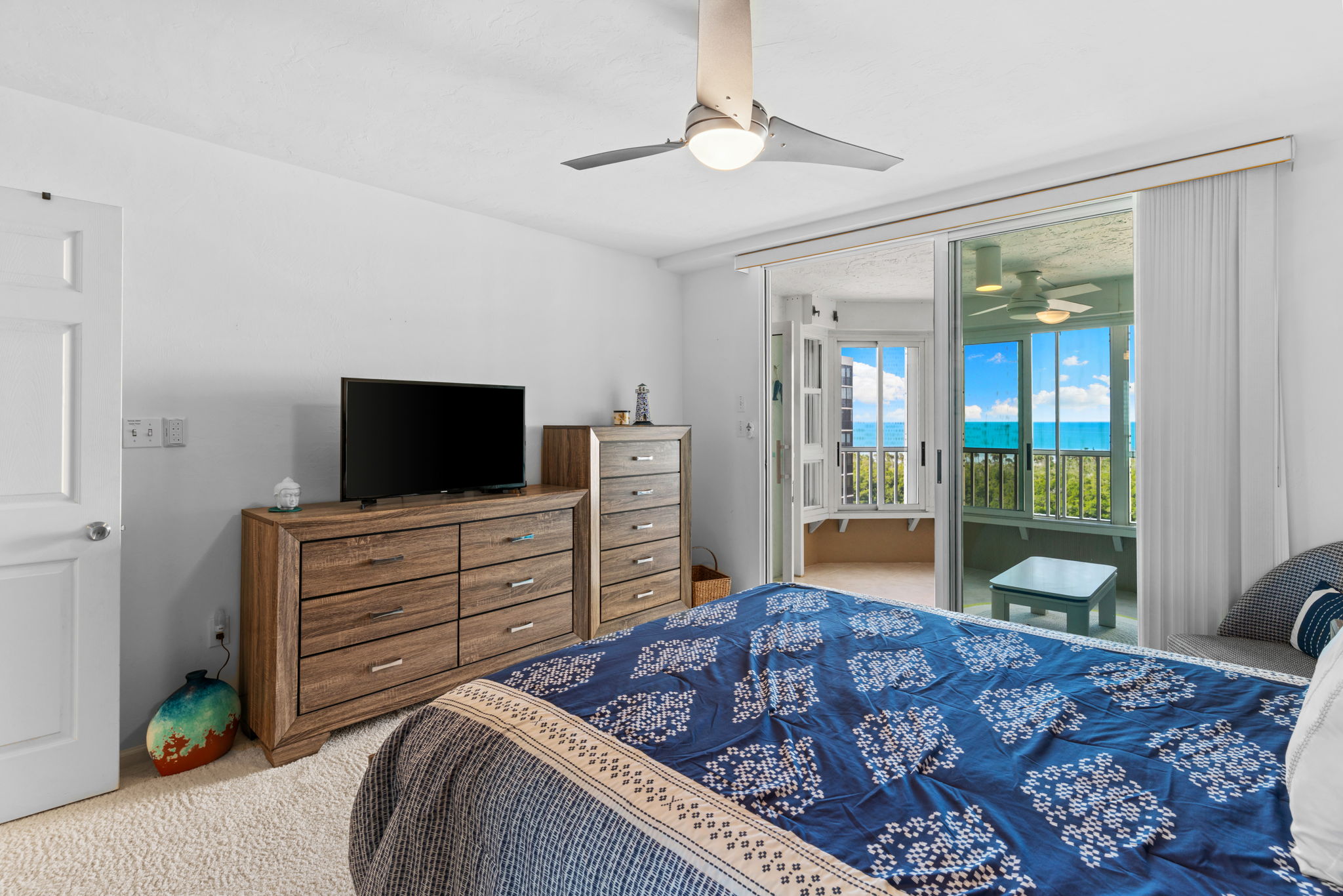 Comfortable guest bedroom with easy access to the enclosed lanai