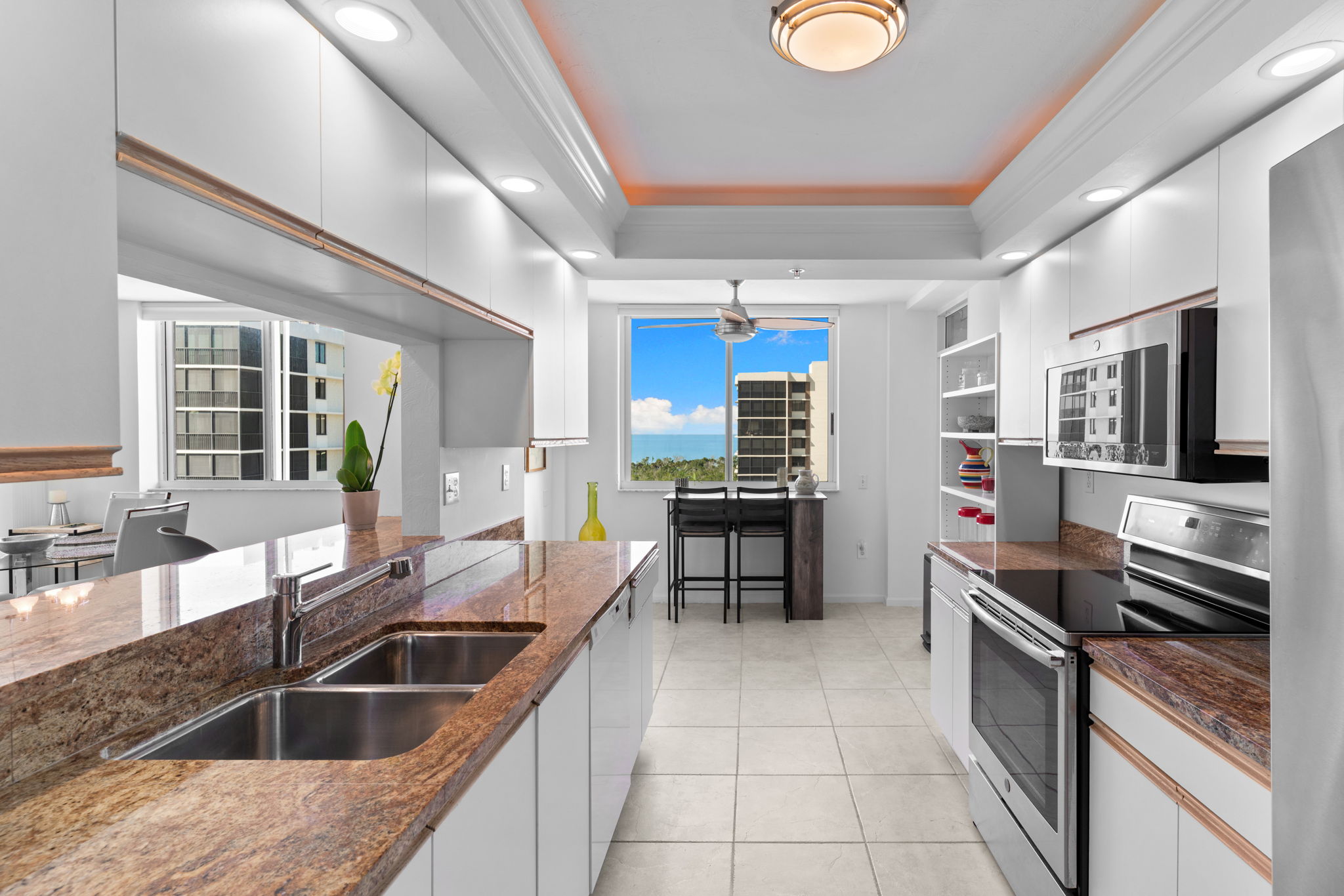 Bright, functional kitchen with ample storage and natural light