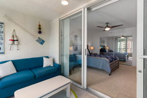 Second bedroom with access to a glass-enclosed lanai, ideal for flexible use