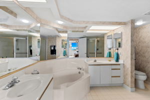 Primary ensuite with separate tub and shower