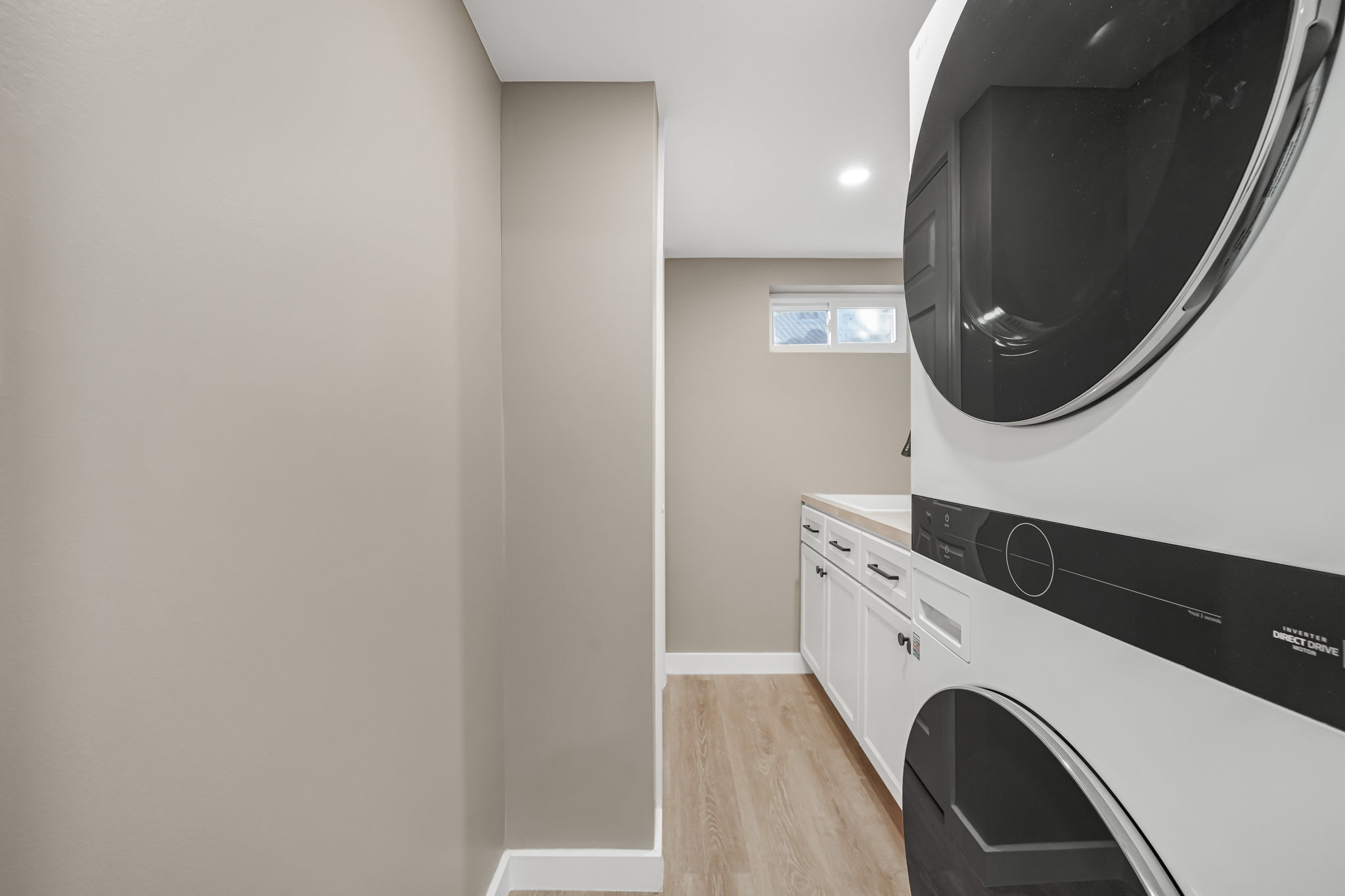 Laundry Room with counter and storage