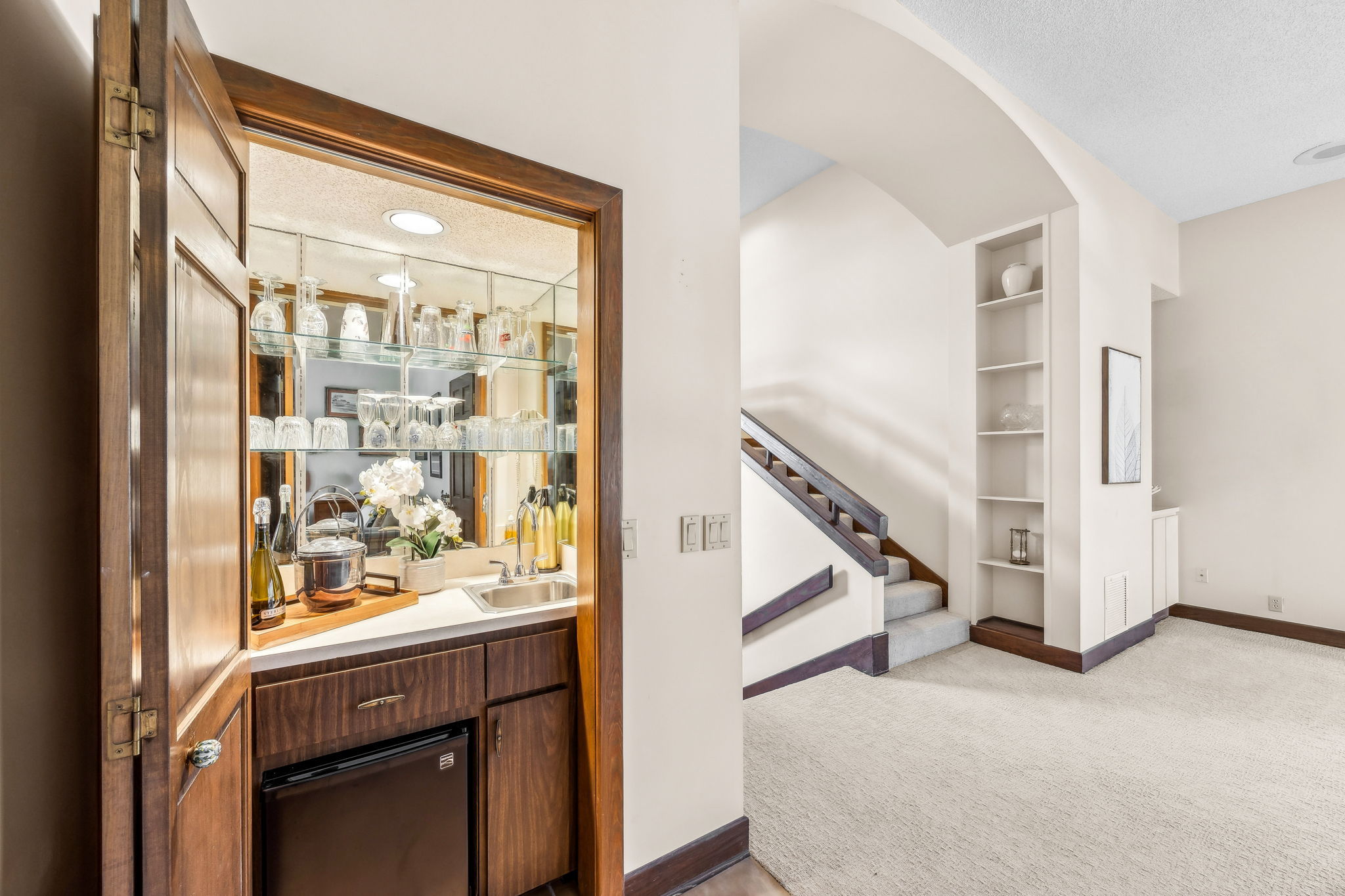 Just off the living area, an adjacent bar designed for effortless hosting.